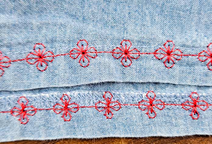 Red stitches on blue fabric