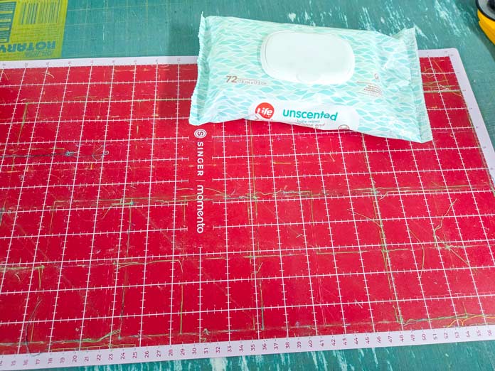 Baby wipes on a red digital cutting mat