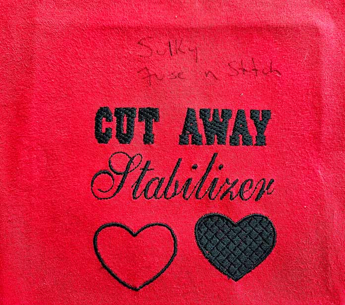 Black stitching on red fabric