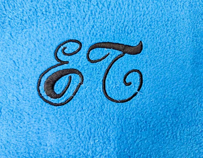 Black lettering on blue fabric