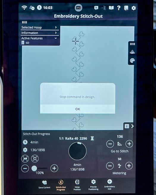 Embroidery Stitch-Out screen on the PFAFF creative icon 2 showing active stitching of a custom decorative sequence using Single Ribbon Stitch #8.1.6 from Category 8 – Techniques. The screen displays a pop-up message reading “Stop command in design,” indicating a programmed pause point for ribbon placement. The Stitch-Out Progress panel at the bottom shows the design at stitch 136 out of 1898, with real-time tracking options. Hoop size is set to 260 x 200 mm, and Active Feature 6D is enabled. All editing and positioning controls are visible along the bottom and right edges of the interface.