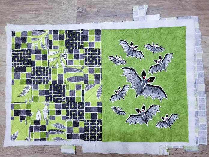 A green, white, and gray placement with gray bats