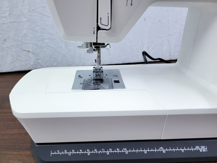 The base of a white sewing machine; on the Husqvarna VIKING ONYX 25