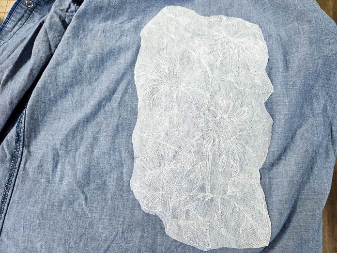 A white fabric on blue denim