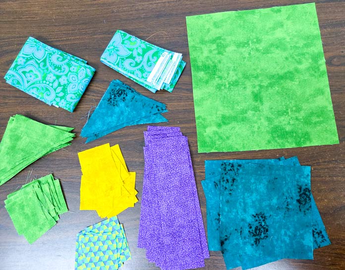 Green, purple, and yellow fabric pieces