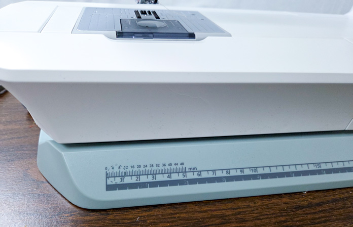 Rulers along the base of a sewing machine
