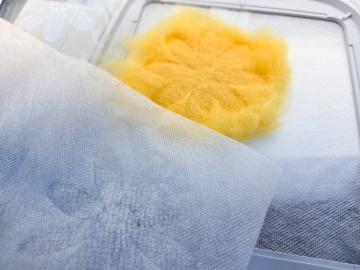 A yellow flower using yellow roving