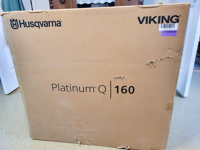 A large cardboard box with PLATINUM™ Q160 printed on it