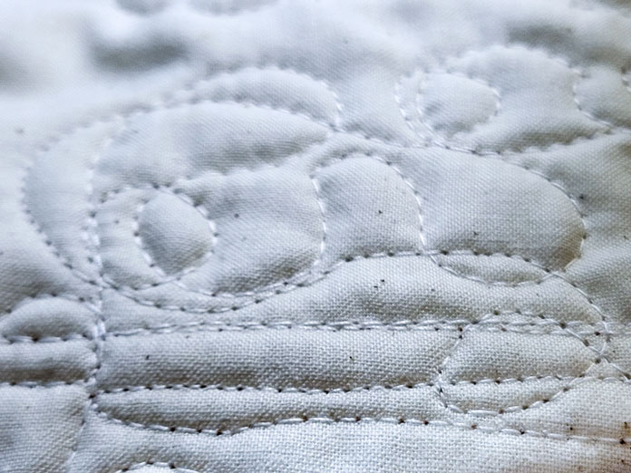 Cream quilting stitches on cream-colored fabric; Husqvarna Viking PLATINUM™ Q160