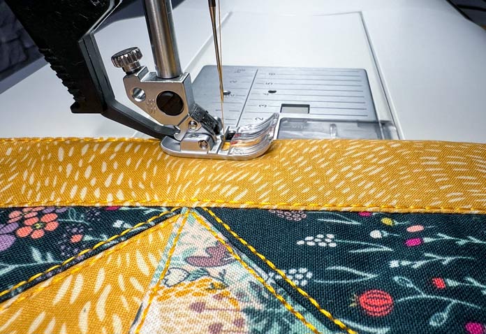 Close-up of stitching the cushion case with PFAFF OA - Standard Presser Foot for IDT System and adjust IDT System