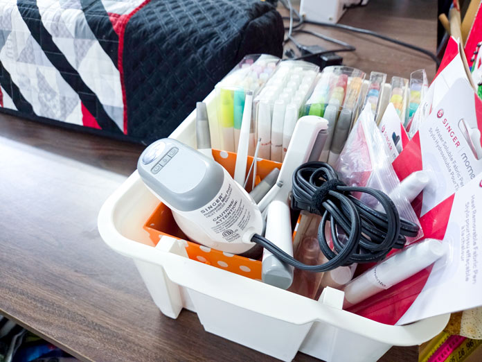 A white box filled with markers