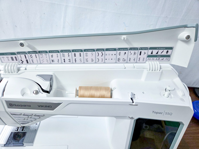 The top of a white sewing machine