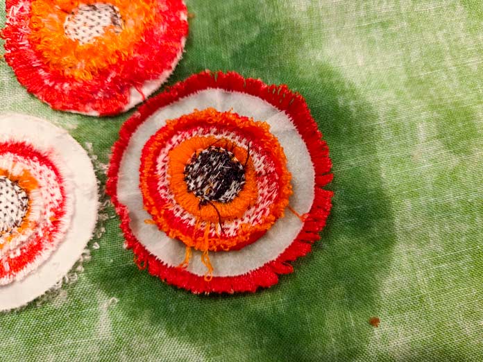 The back of a machine-embroidered flower
