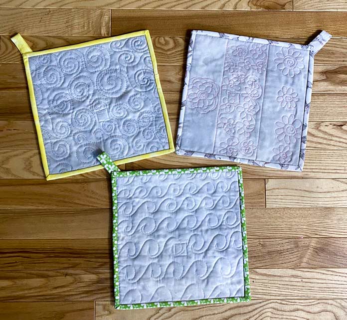 3 free motion spiral practice samples turned into potholders; Fabric Creations Fabric
