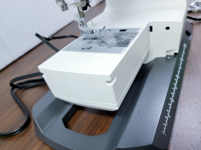 A base of a white sewing machine; on the Husqvarna VIKING ONYX 25