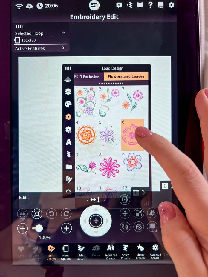 A purple model of the PFAFF creative icon 2 with Embroidery Edit mode and loading the design from embroidery build-in library flower#6 