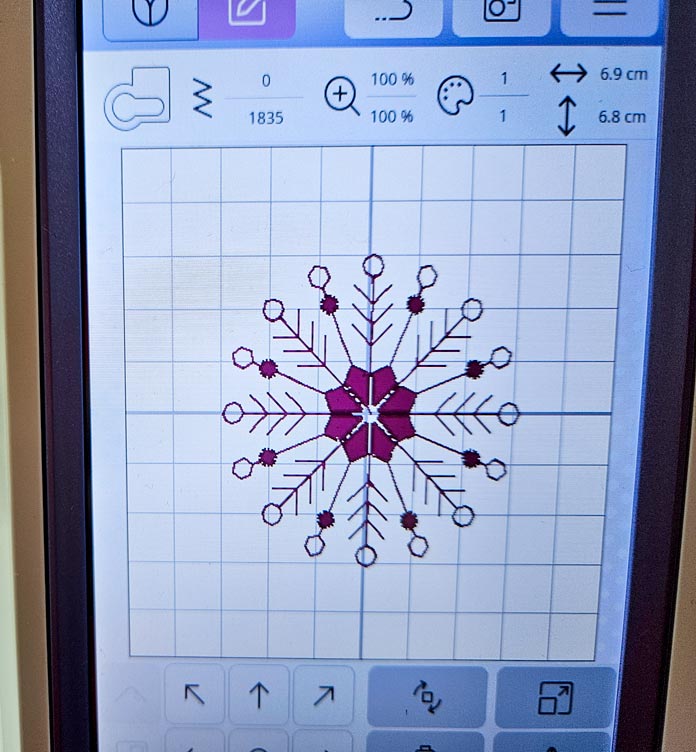 A snowflake on the screen of a computerized sewing and embroidery machine; Husqvarna VIKING Designer Quartz 29, mySewnet Machine Embroidery Software, mySewnet Library, Husqvarna VIKING Tear-a-Way Light Stabilizer 15 Inches x 25 Yards