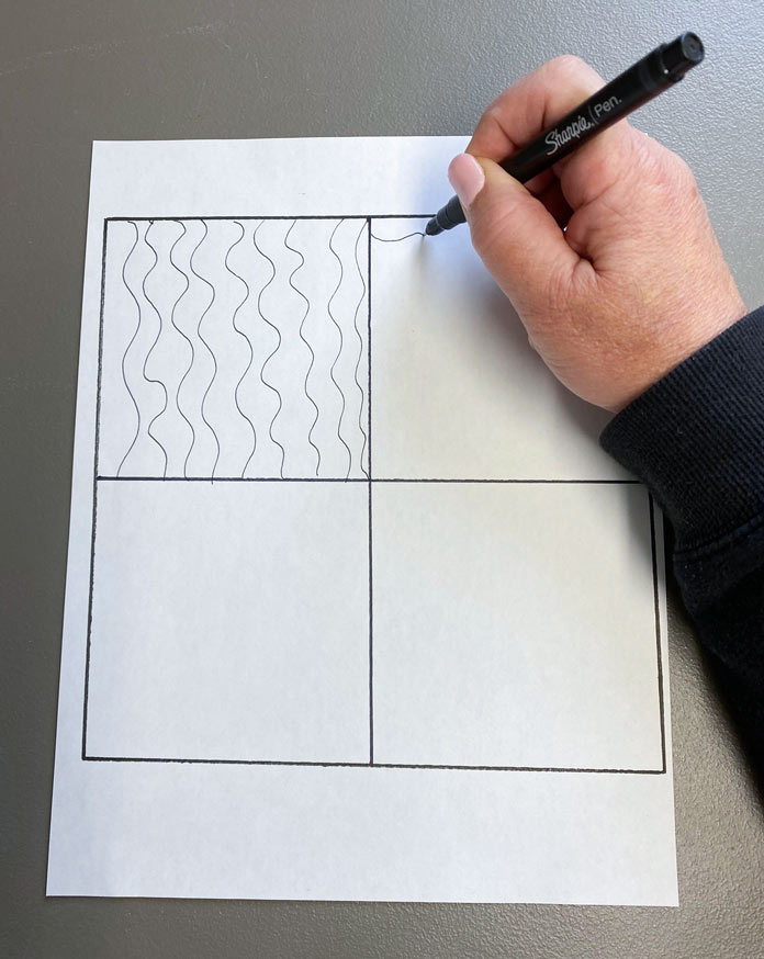 Drawing wavy lines to learn free motion quilting.