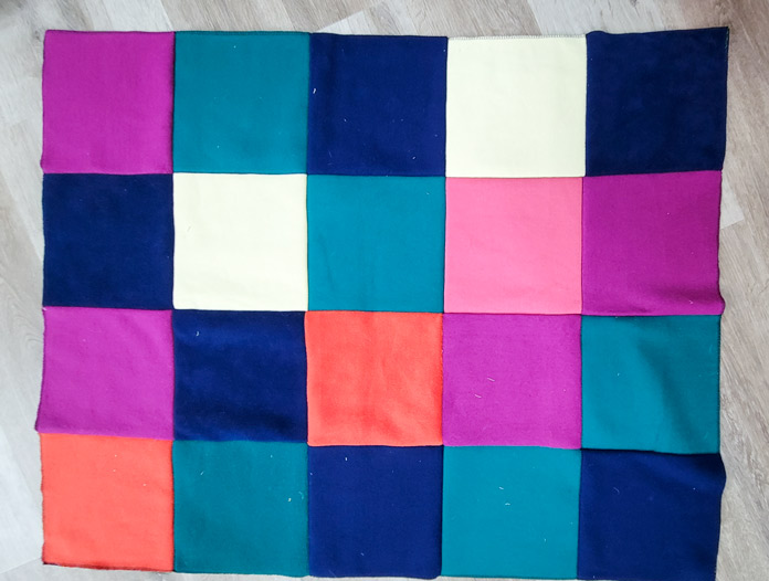 Multi-colored squares of fleece sewn together