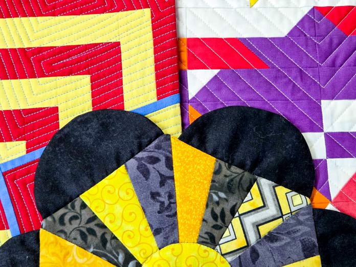 Brightly colored quilts