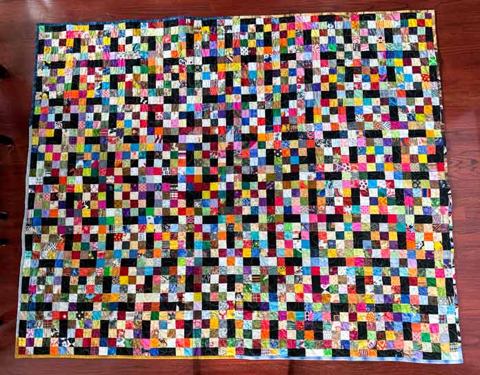 The completed quilt with a total of 80 blocks each containing 16 – 2” x 2” squares.