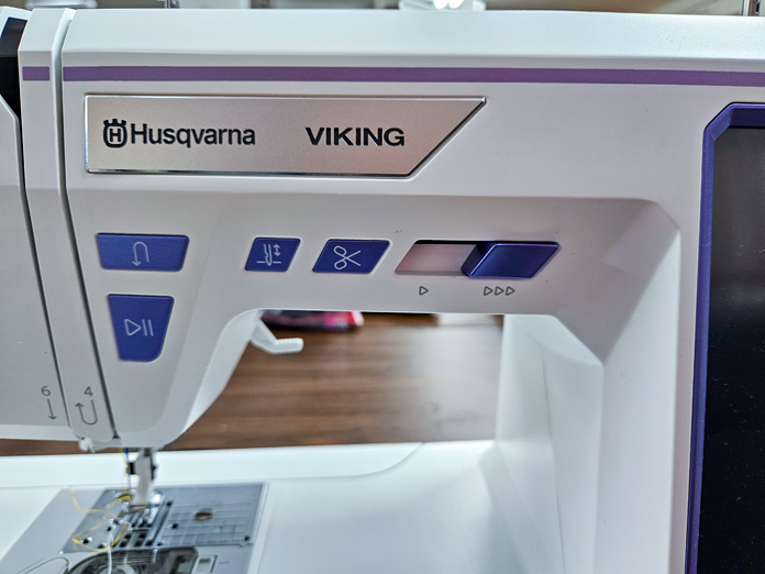 Purple function buttons on a white sewing machine; Husqvarna VIKING Designer Quartz 29, mySewnet Machine Embroidery Software