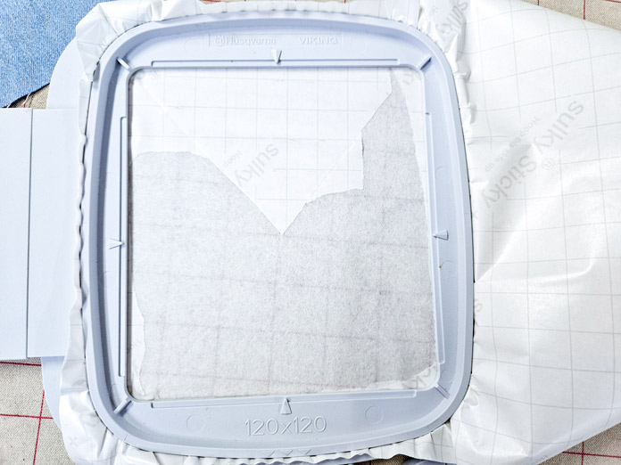 White paper in a grey machine embroidery hoop
