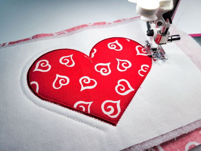 A red heart on white fabric