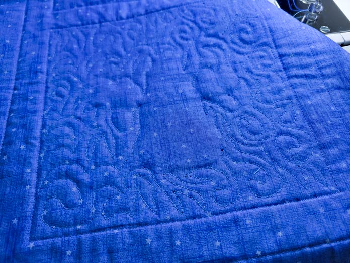 Blue stitching on blue fabric