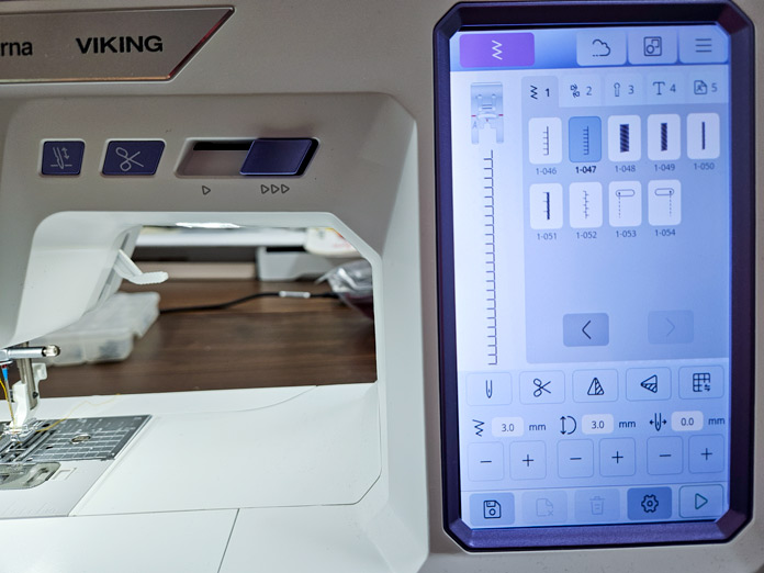 A screen on a computerized sewing machine shows the applique stitches; Husqvarna VIKING Designer Quartz 29, mySewnet Machine Embroidery Software, Husqvarna VIKING Tear-a-Way Light Stabilizer 15 Inches x 25 Yards