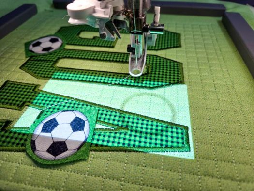 Soccer ball fabric on green fabric