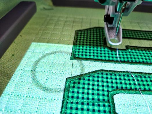 Soccer ball fabric on green fabric