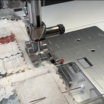 The ¼” Quilting Foot for the IDT System maintains a precise seam allowance of a ¼”. A half-step-up presser foot position provides a maneuver for folding the seam allowance at a proper positioning or correction if needed and removing the pins with no harm to the machine.