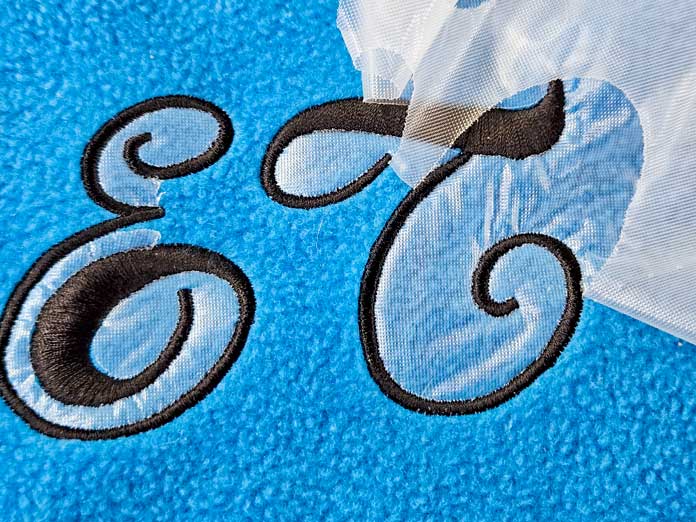 Black lettering on blue fleece