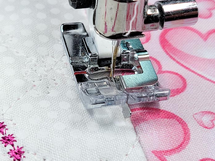 A sewing machine presser foot; Husqvarna Viking Adjustable Stitch in the Ditch Foot for IDF, Husqvarna Viking Designer EPIC 2