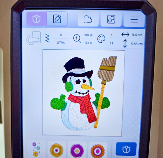 A snowman on the screen of a computerized sewing and embroidery machine; Husqvarna VIKING Designer Quartz 29, mySewnet Machine Embroidery Software, mySewnet Library, Husqvarna VIKING Tear-a-Way Light Stabilizer 15 Inches x 25 Yards