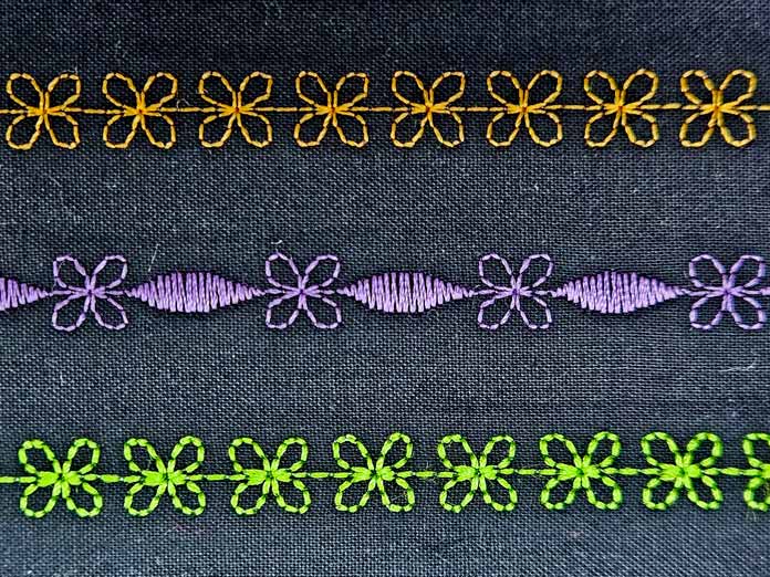 Three rows of sewing machine stitching in gold, purple, and green; Husqvarna VIKING DESIGNER EPIC 3
