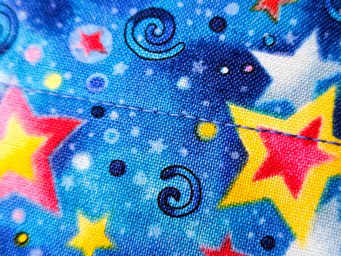 Yellow and red stars on blue fabric