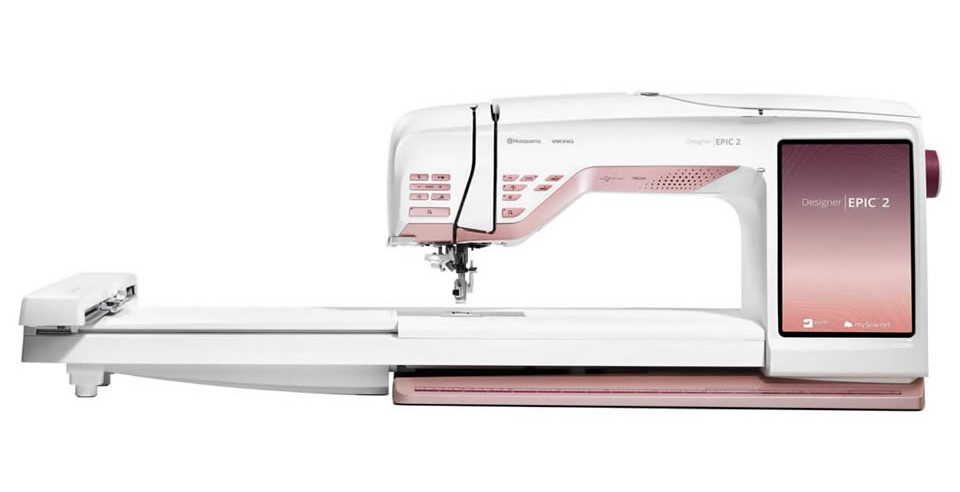 A white and burgundy sewing machine with an embroidery arm; Husqvarna Viking Designer EPIC 2
