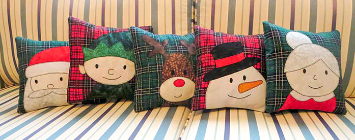 A set of Christmas cushions with fusible applique; Fairfield Poly-fil, HeatnBond Featherlite, SCHMETZ nonstick needles, Olfa frosted ruler, free pattern