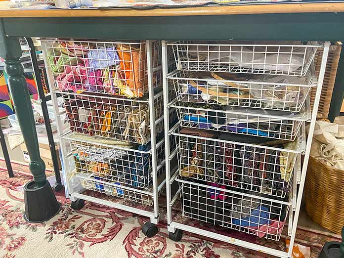 Metal frames with wire basket drawers.
