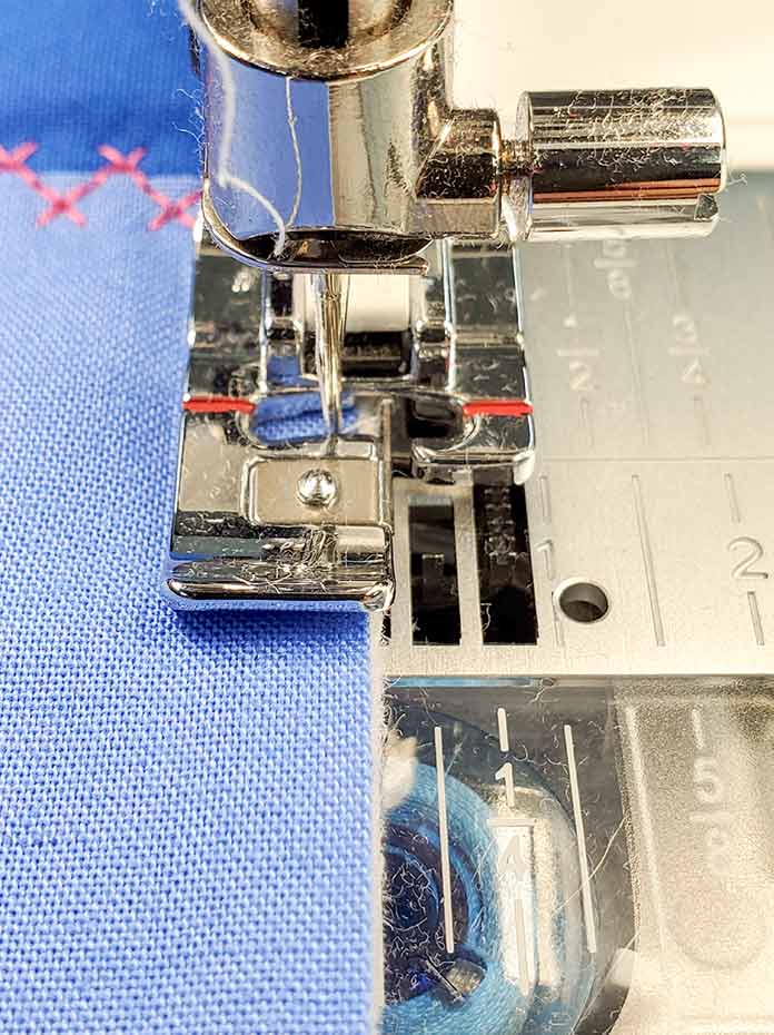 The J presser foot is used to overcast the edge of a quilt sample. Husqvarna Viking EPIC 95Q