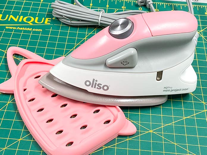 The Oliso M2Pro Mini Project Iron has the power of a full-sized iron in a compact and lightweight design. UNIQUE Wool Pressing Mat, Oliso M2Pro Mini Project Iron, Oliso Pro TG1600 Smart Iron, UNIQUE Quilting Therm Fleece, Fairfield Toasty Cotton Natural Cotton Quilt Batting