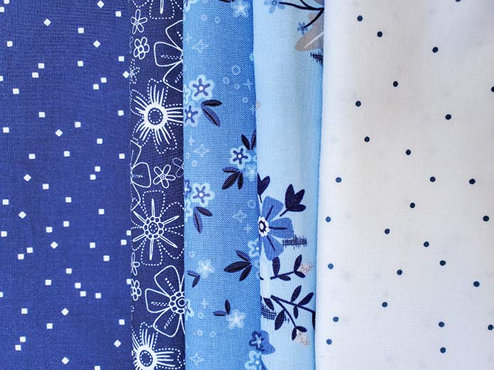 Five fabrics from the Blue Stitch collection by Christopher Thompson for Riley Blake Designs; QAL2020