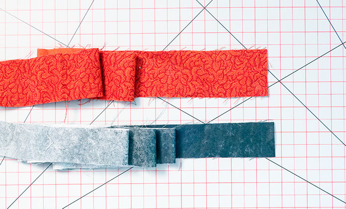  The two fabrics to be used to create a binding with a flange or faux-piping.