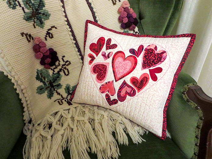 Finished Valentine pillow; Brother ScanNCut SDX225, Brother Innov-ís BQ3050, Brother spatula and hook set, standard tack cutting mat, Brother brayer