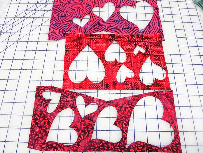Negative space fabric scraps backed with fusible web Brother ScanNCut SDX225, Brother BQ3050 sewing machine, Brother brayer, Brother spatula, Brother standard tack cutting mat