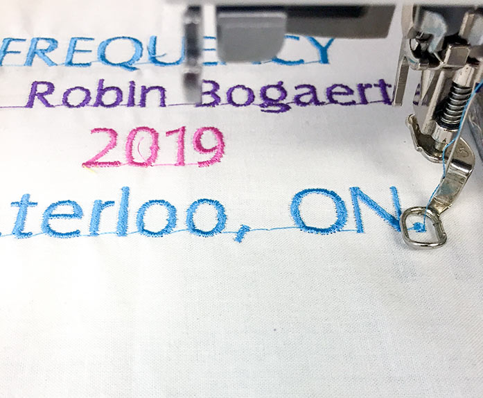 Detail of the label being machine embroidered.