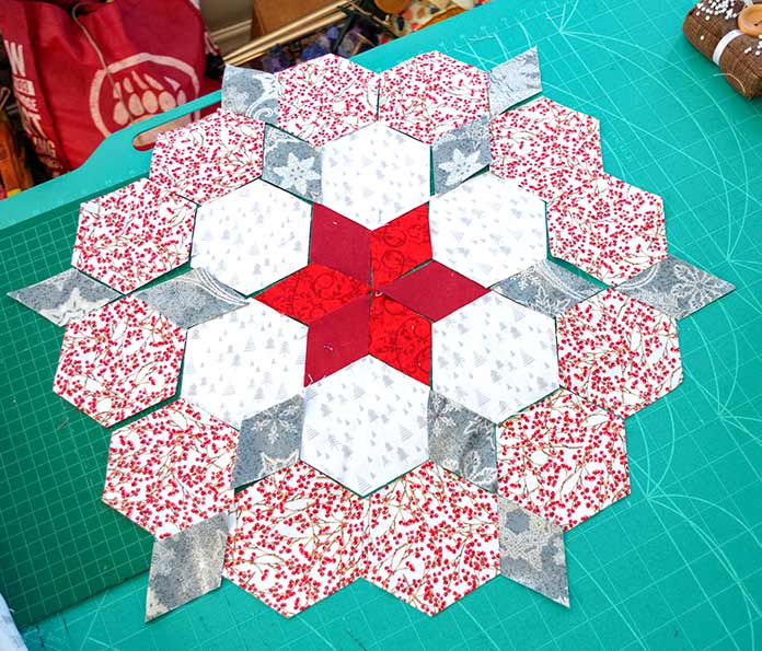 Red star center surrounded by white and gray hexies with red and white hexies on the outside. 