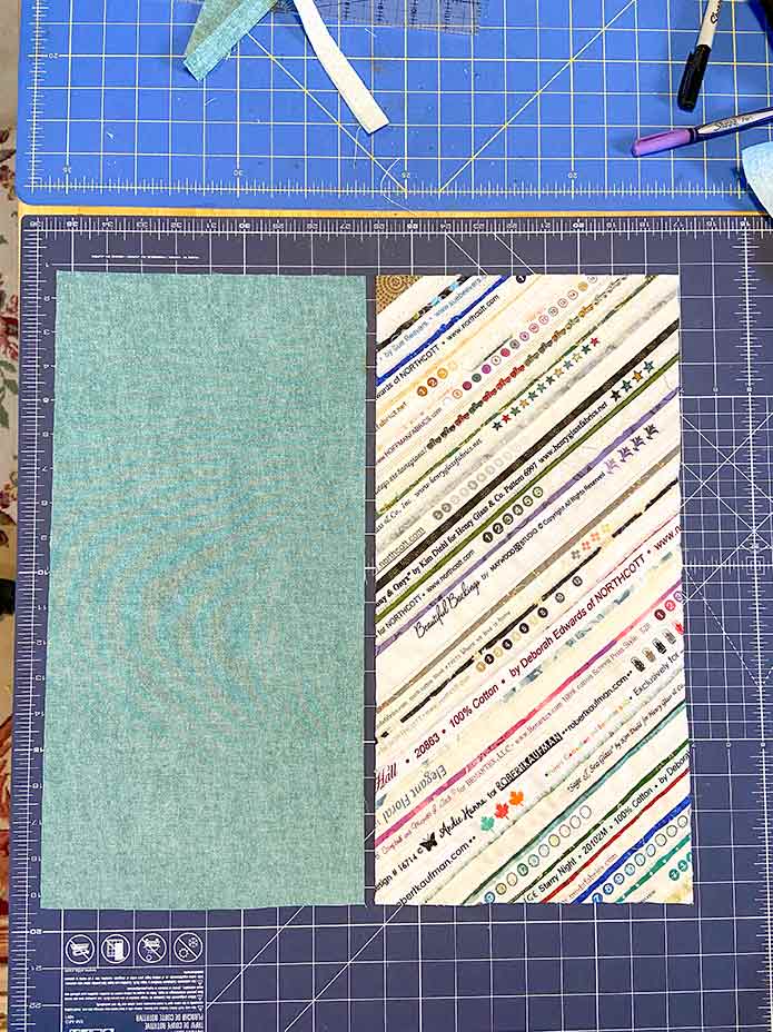 A 9" x 18" rectangle of the selvage panel will be the outside of the bag, while the same size rectangle of the fabric used for the binding will be the lining of the bag.